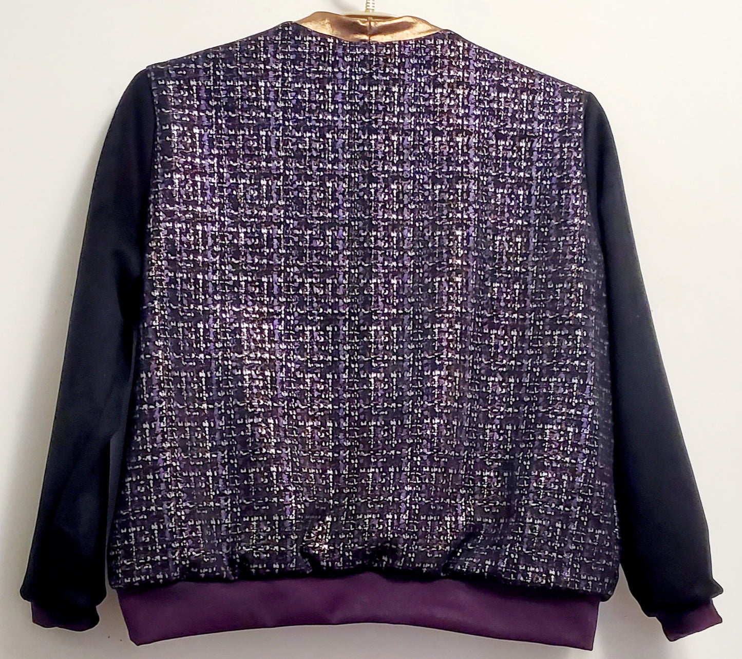 Back view of Purple, silver, and copper tweed printed bomber jacket
