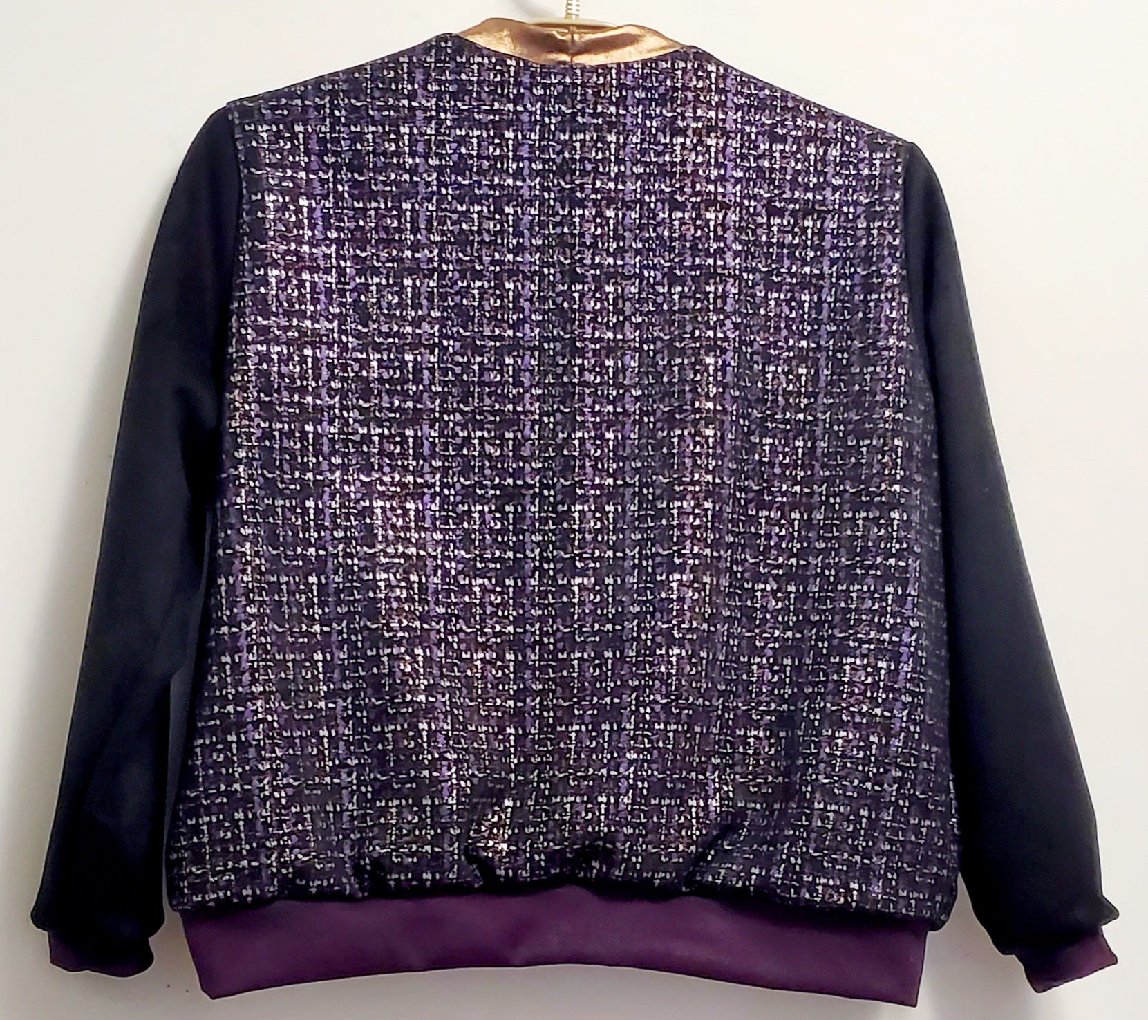 Back view of Purple, silver, and copper tweed printed bomber jacket