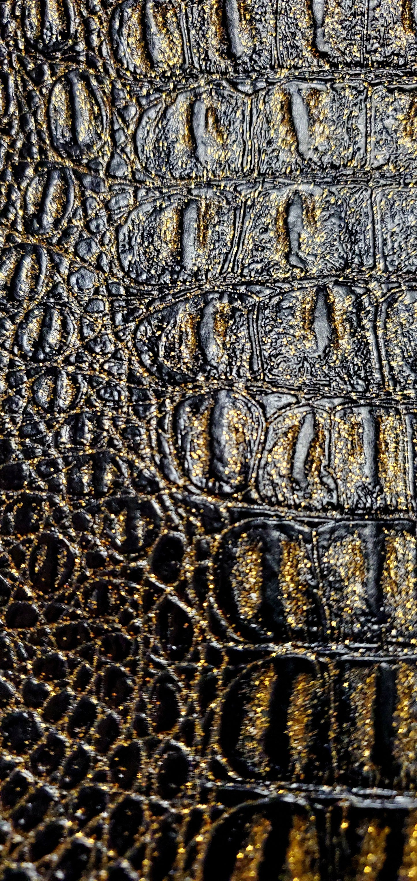 Close up view of crocodile embossed vegan leather