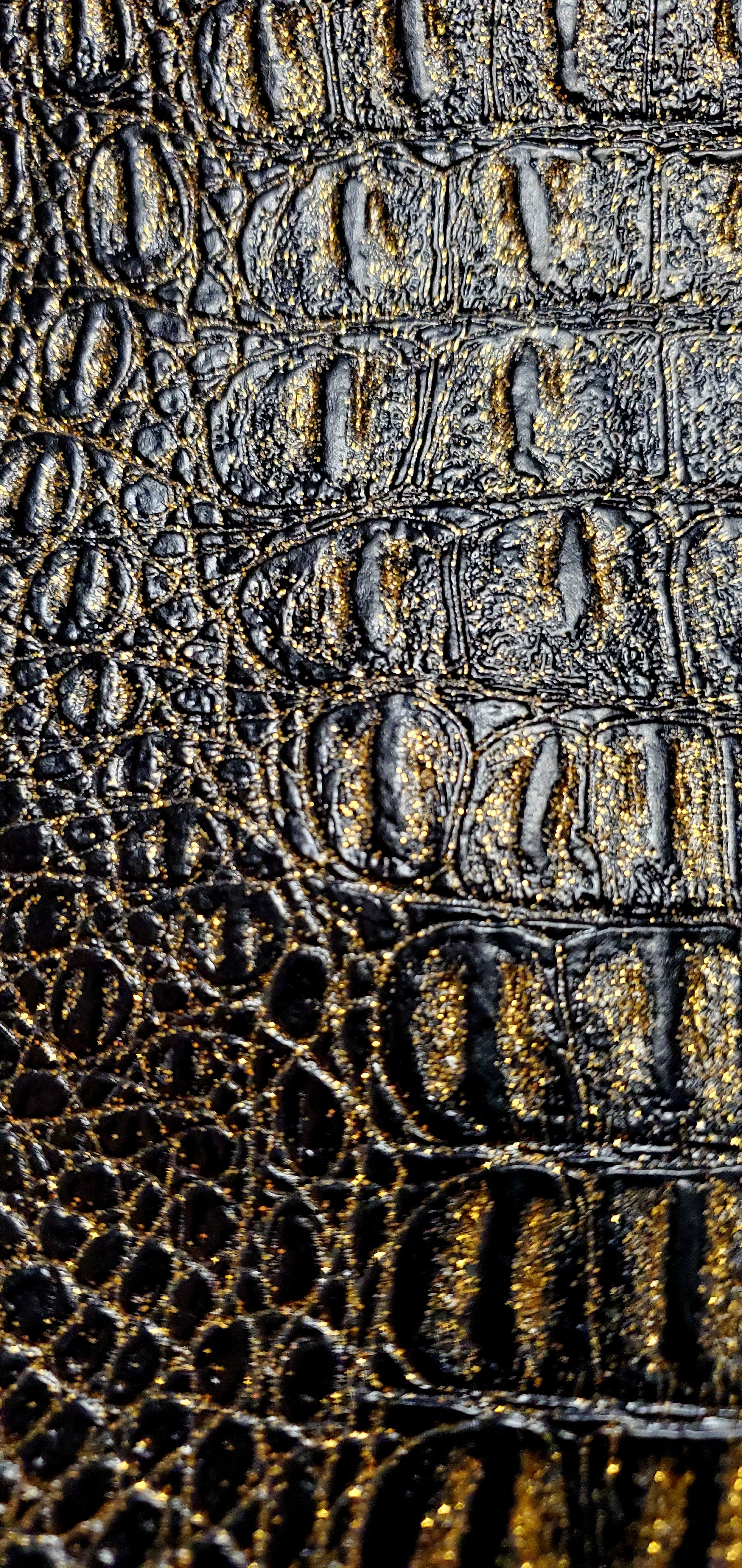 Close up view of crocodile embossed vegan leather