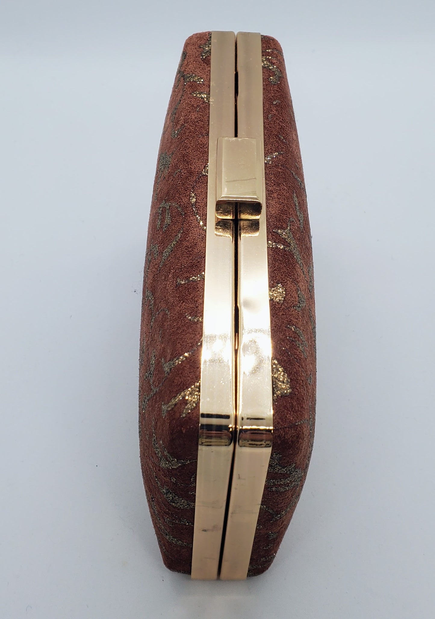 top view of Suede and copper maudier clutch