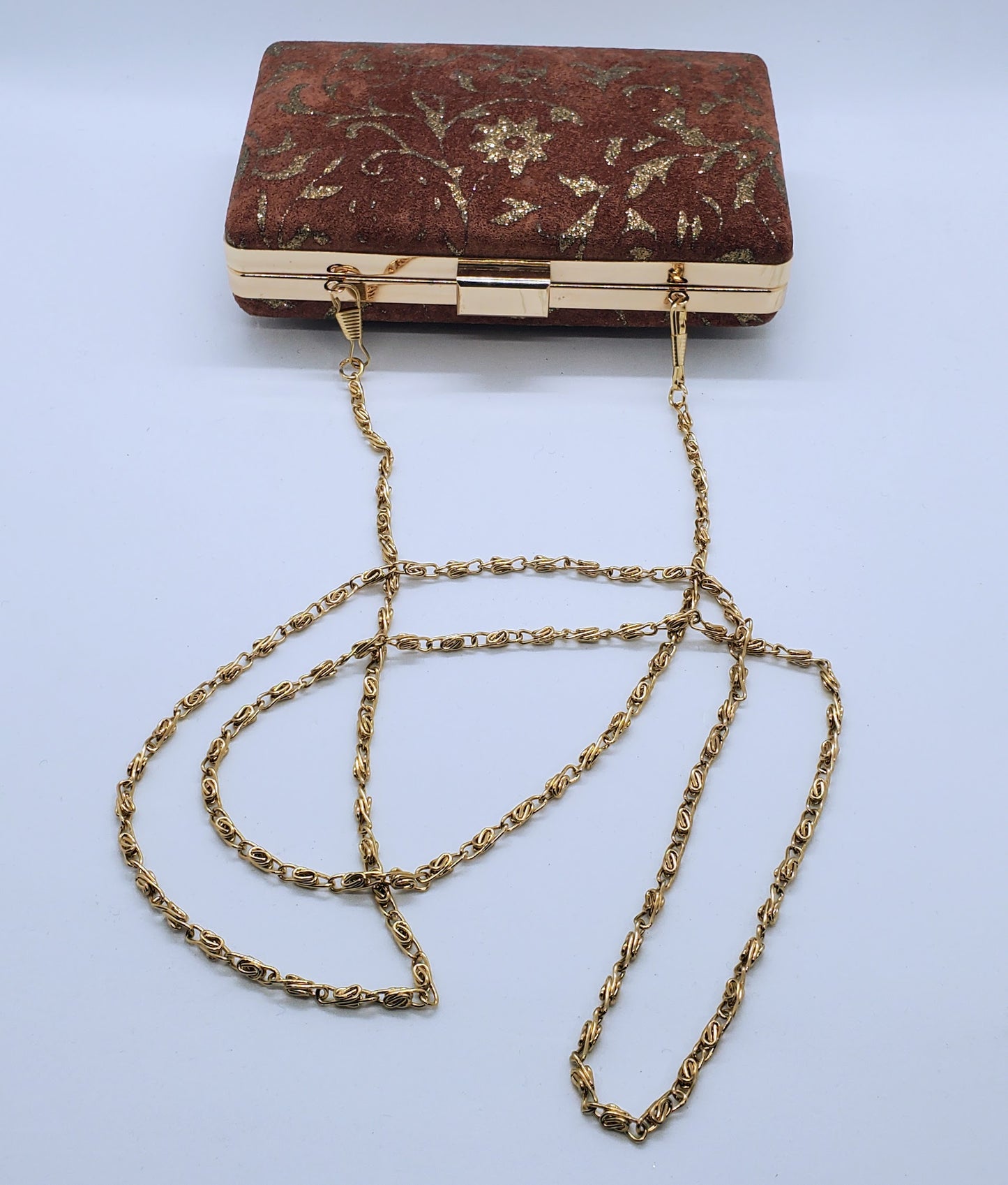 side view of Suede and copper maudier clutch