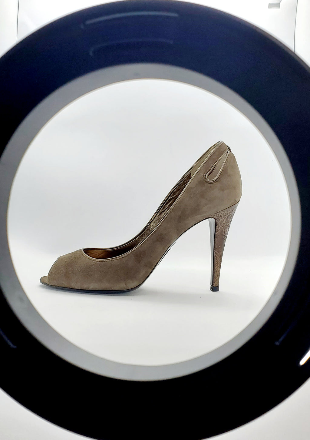 Keyhole view of Elie Tahari Suede open toe pump with ornate patterned keyhole heels