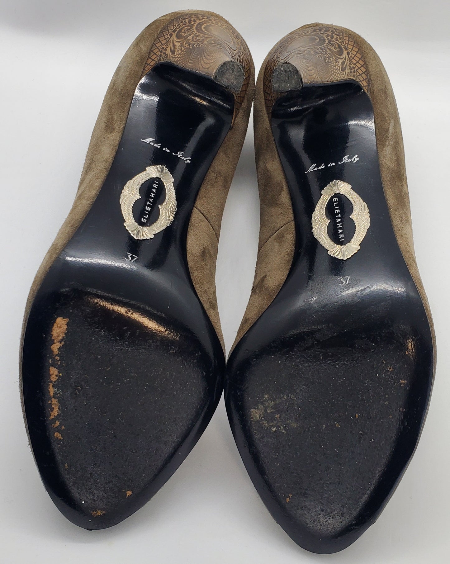 Bottom view of Elie Tahari Suede open toe pump with ornate patterned keyhole heels