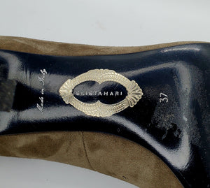 close up view of stamped label of Elie Tahari Suede open toe pump with ornate patterned keyhole heels