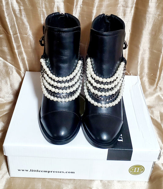 Front view of Black booties with pearl and chain details