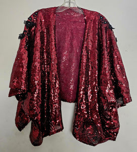 front view of Burgundy sequin kimono jacket with black embroidered shoulders on hanger