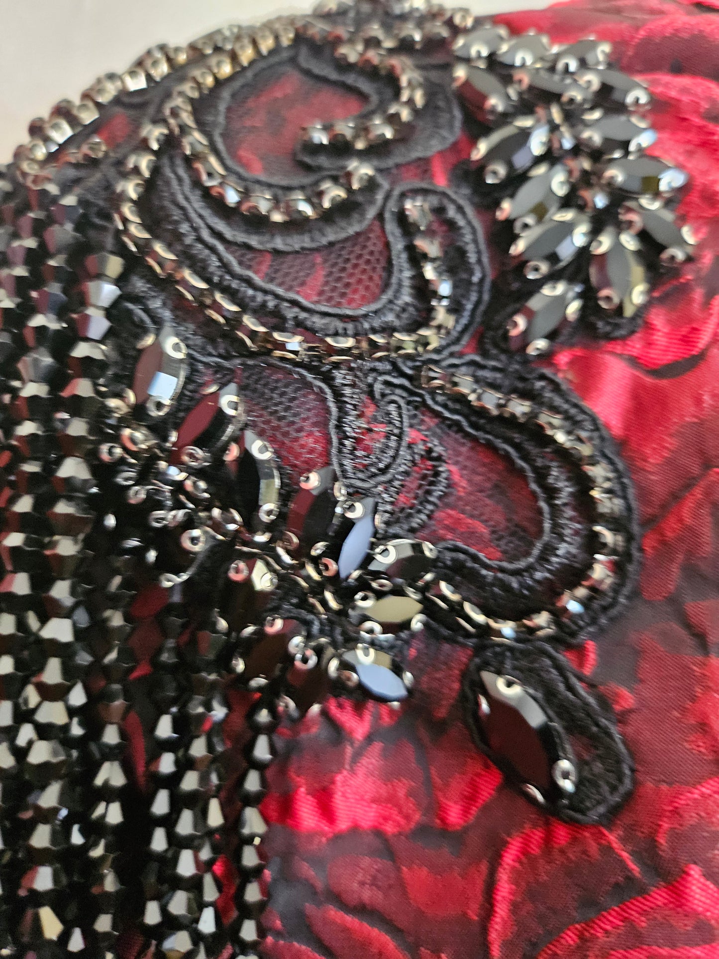 Close up of rhinestone shoulder applique with beaded fringe