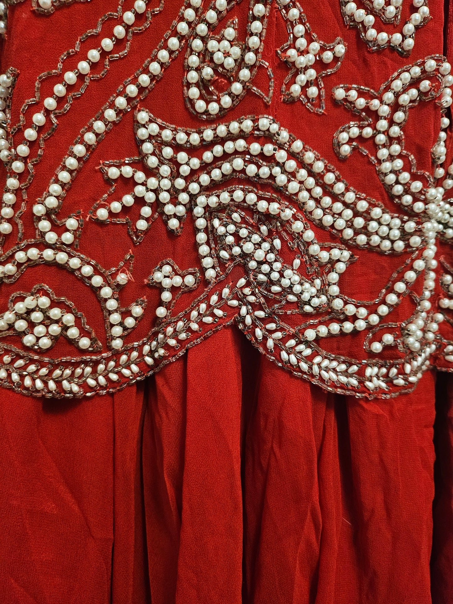close up view of scalloped  bodice hem of Vintage Red Silk and Pearl Beaded Evening Dress