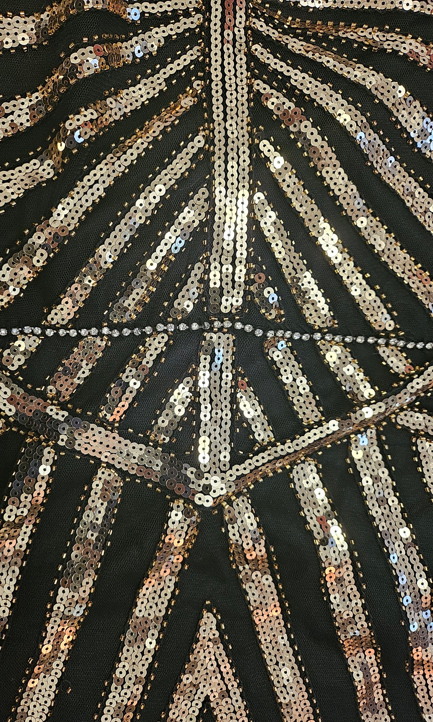 close up view of beading on Art Deco-inspired beaded gown with detachable faux fur stole and appliques