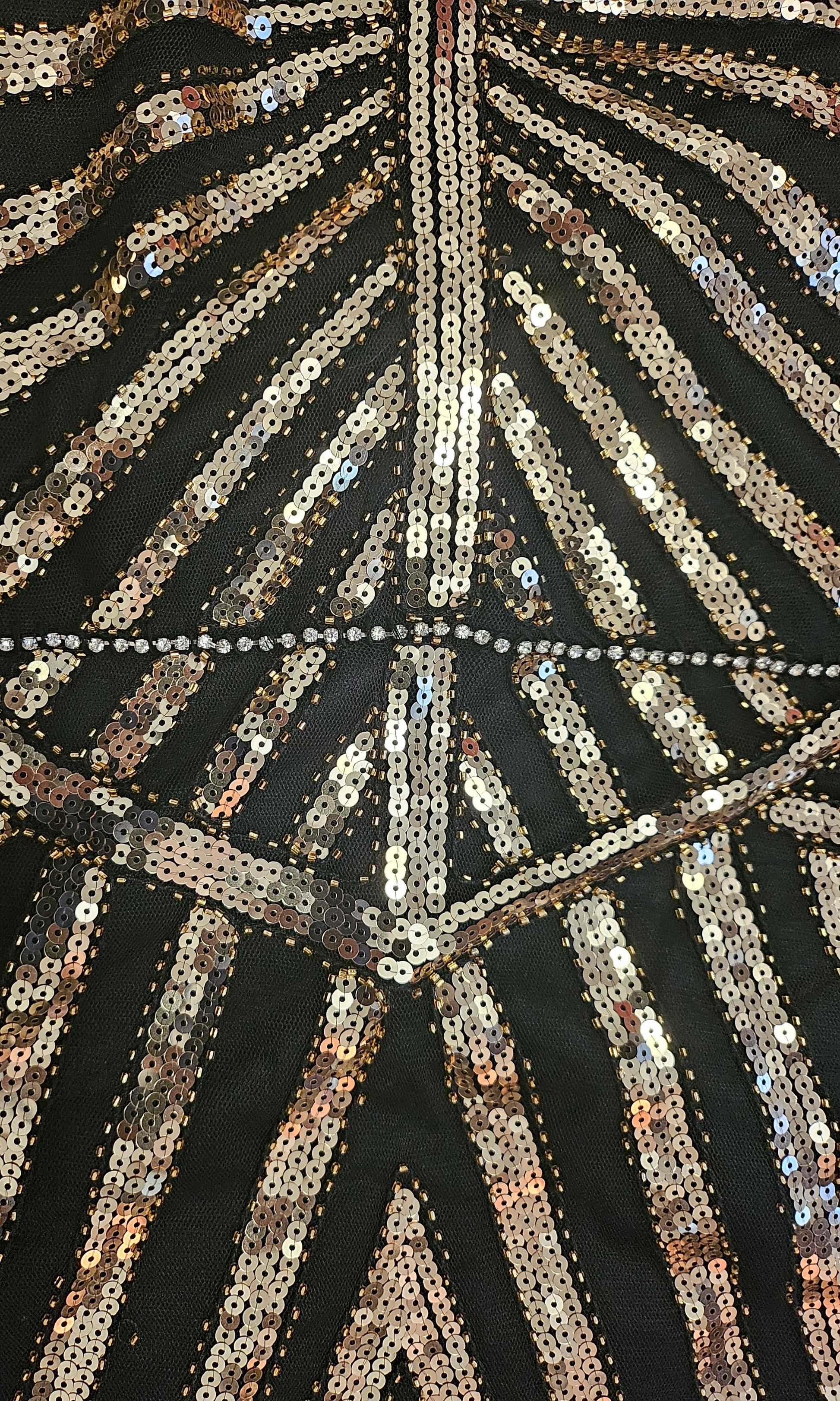 close up view of beading on Art Deco-inspired beaded gown with detachable faux fur stole and appliques