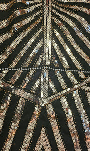 close up view of beading on Art Deco-inspired beaded gown with detachable faux fur stole and appliques