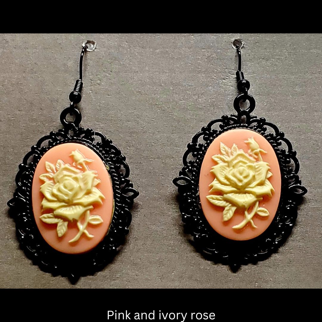 Goth-inspired pink and ivory acrylic 3D rose and black filigree earrings