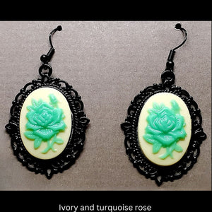 Goth-inspired ivory and turquoise acrylic 3D rose and black filigree earrings