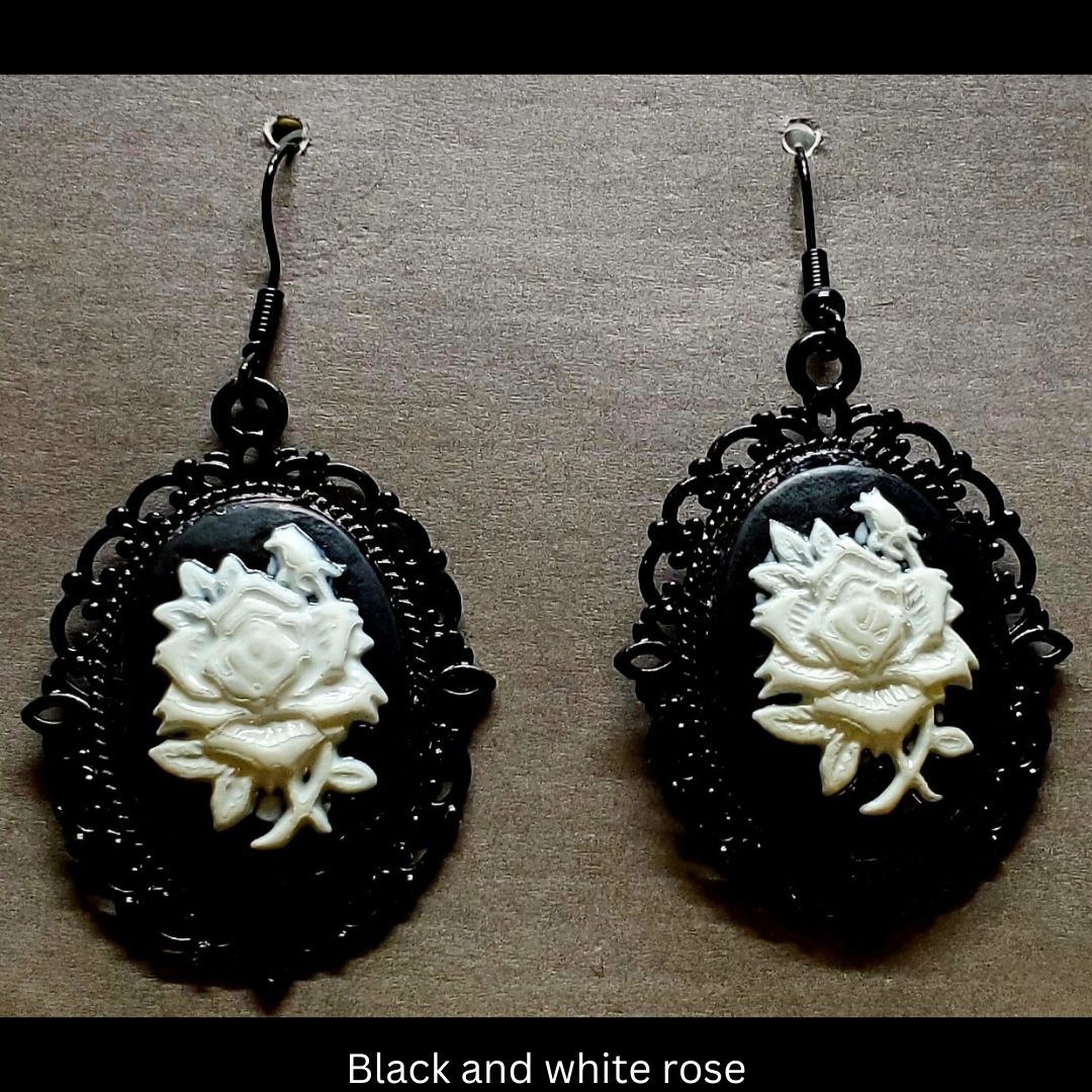 Goth-inspired black and white acrylic 3D rose and black filigree earrings