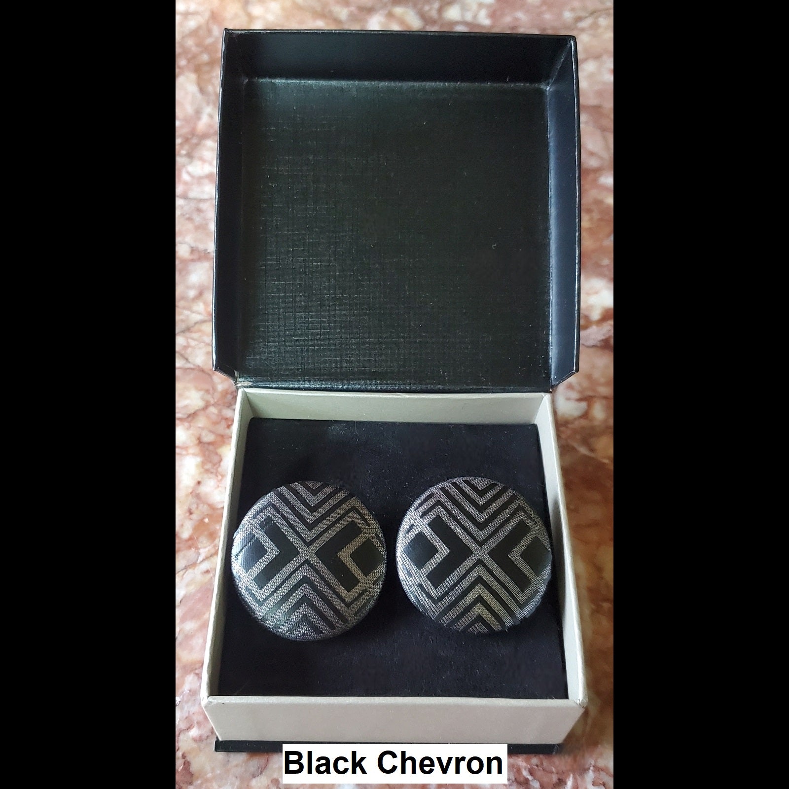 Black and silver chevron print button earrings in jewelry box