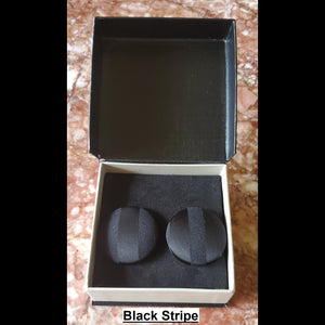Black on black stripe print button earrings in jewelry box 