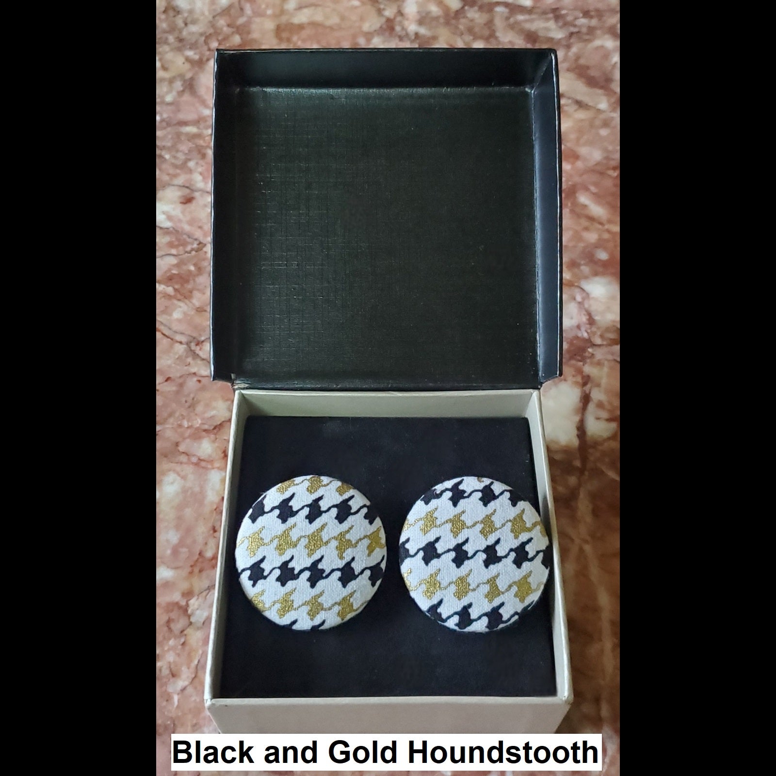 black and gold houndstooth button earrings in jewelry box