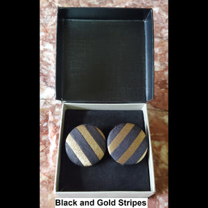 Black and gold stripe button earrings in jewelry box 