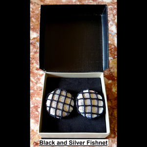 Black and silver fishnet print button earrings in jewelry box