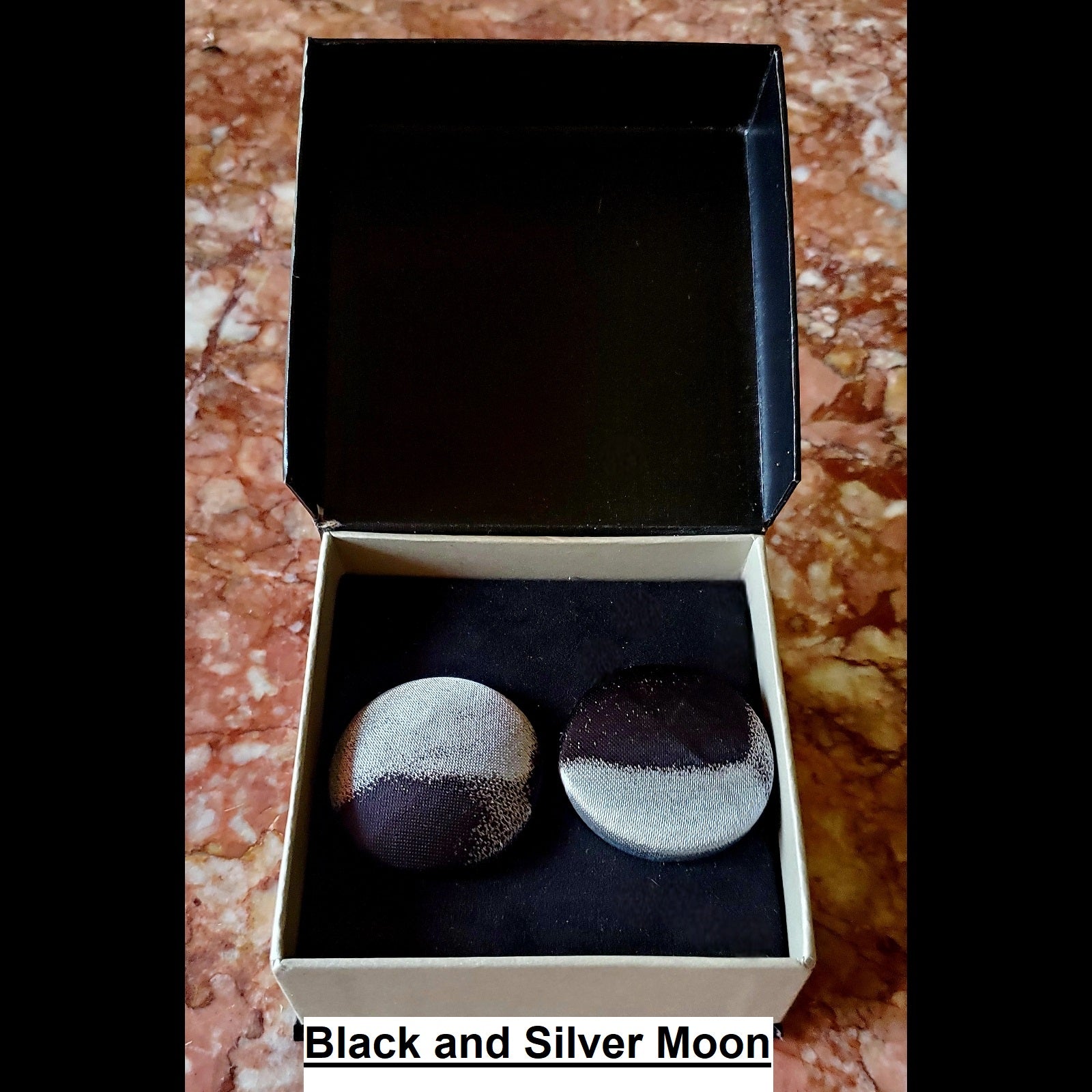 Black and silver moon inspired print button earrings in jewelry box