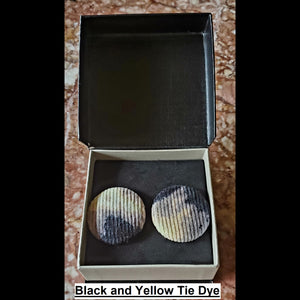 Black and yellow tie-dye print button earrings in jewelry box
