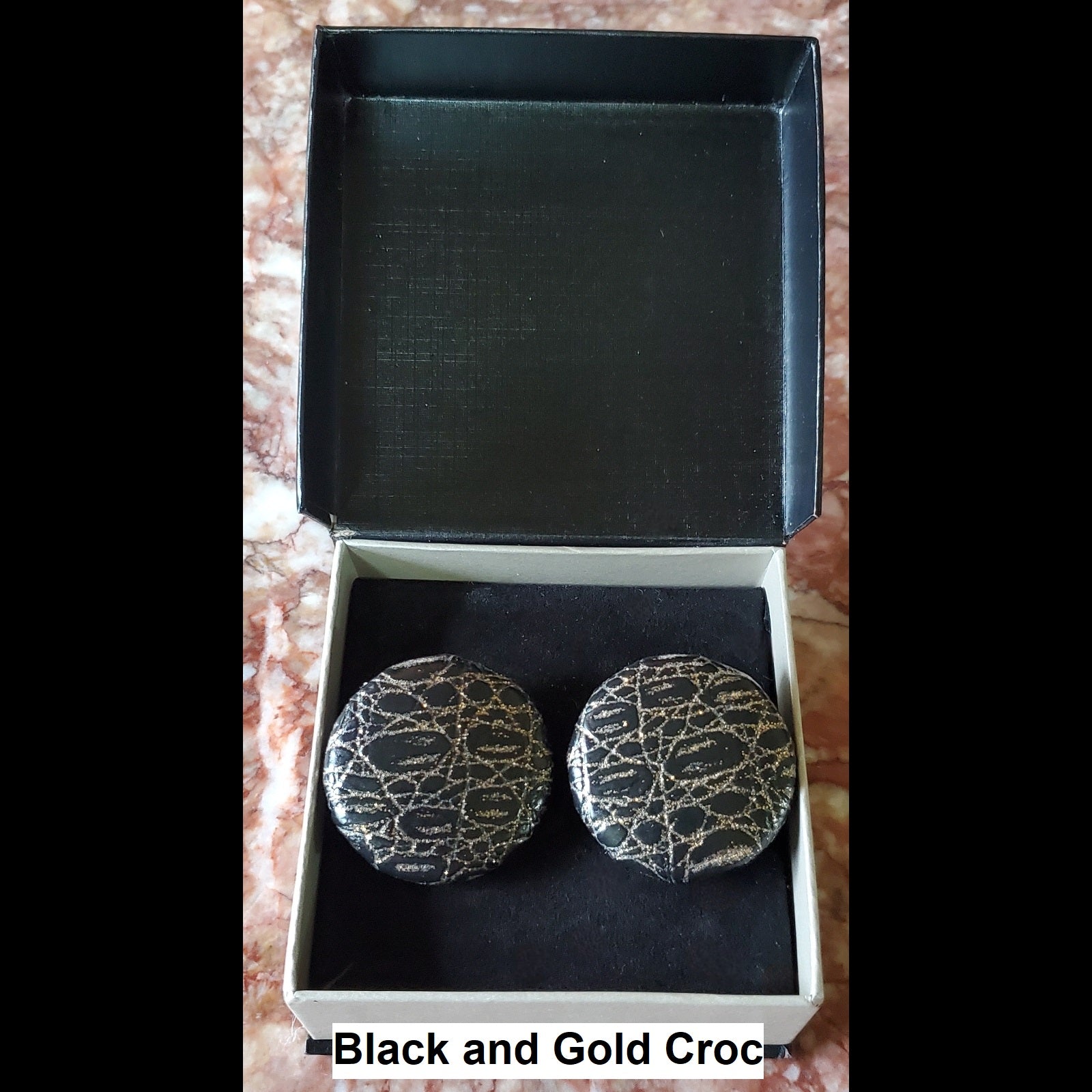 Black and Gold Croc print button earrings in jewelry box