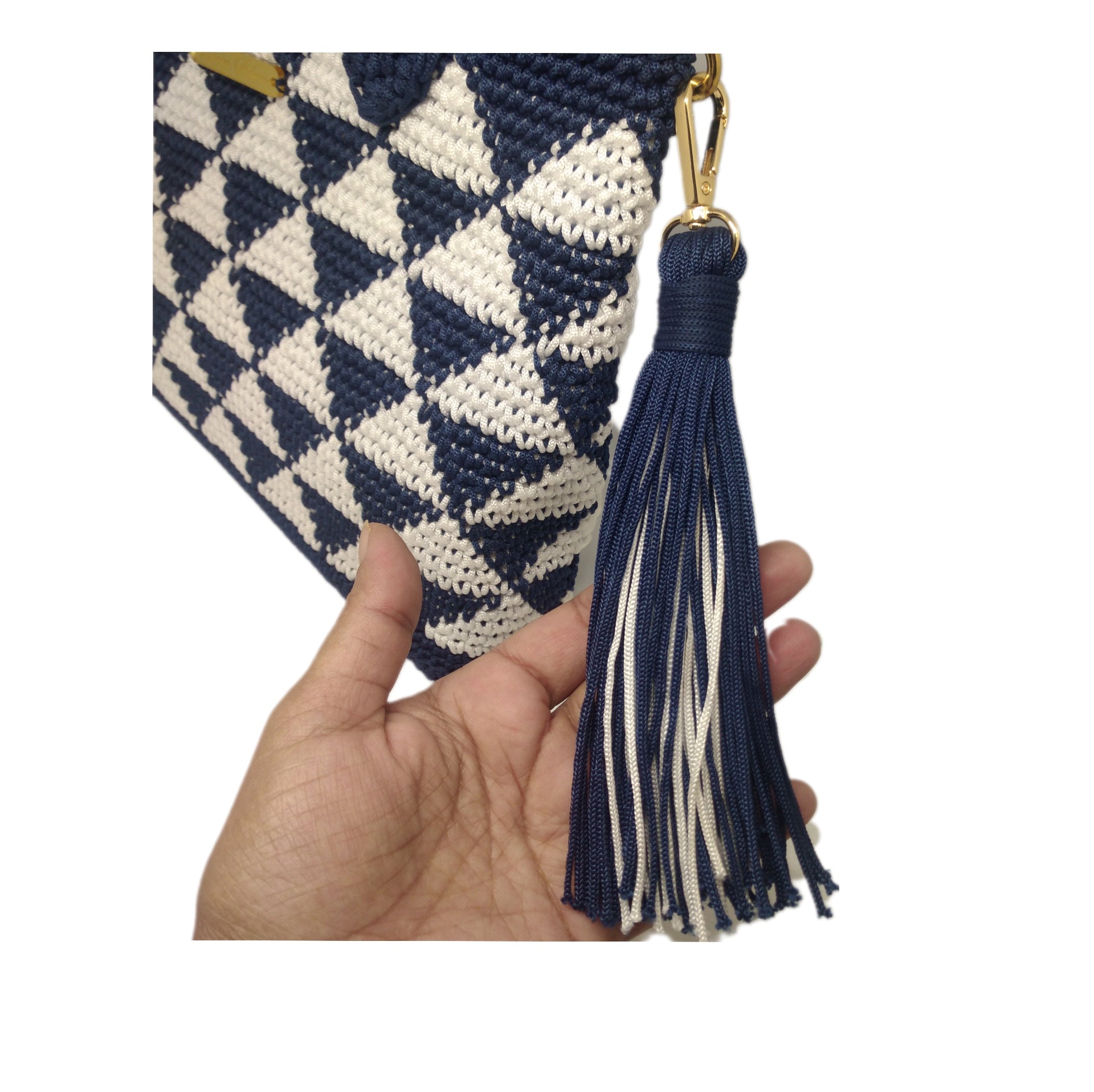  Close up view of tassel on Blue and white crochet geo print handbag 