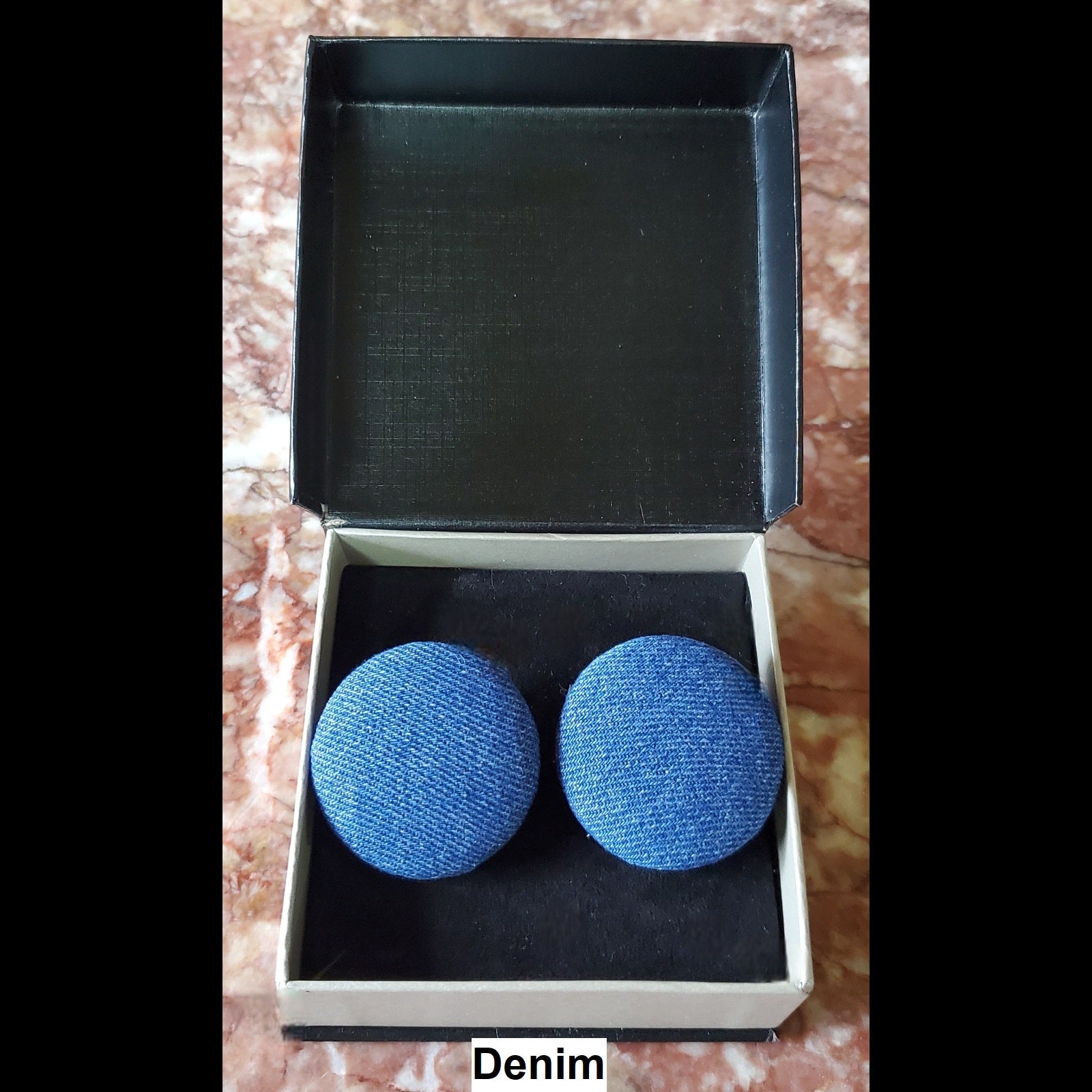 Denim button earrings in jewelry box