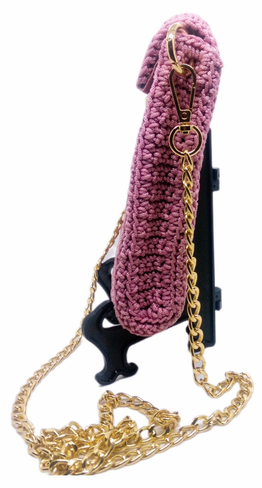 side view of pink crochet crossbody bag