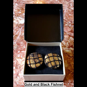 Gold and black fishnet print button earrings in jewelry box
