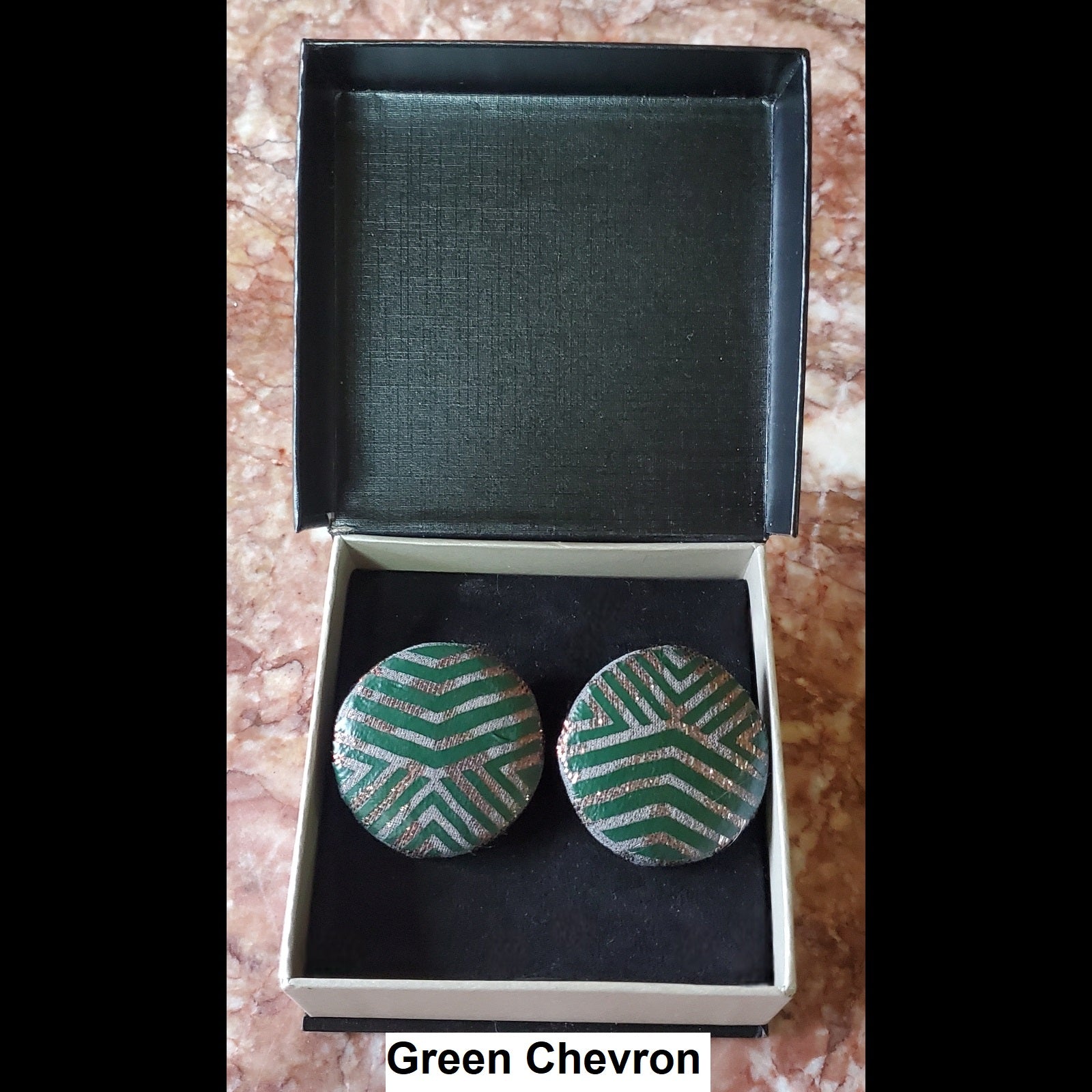 Green chevron print button earrings in jewelry box