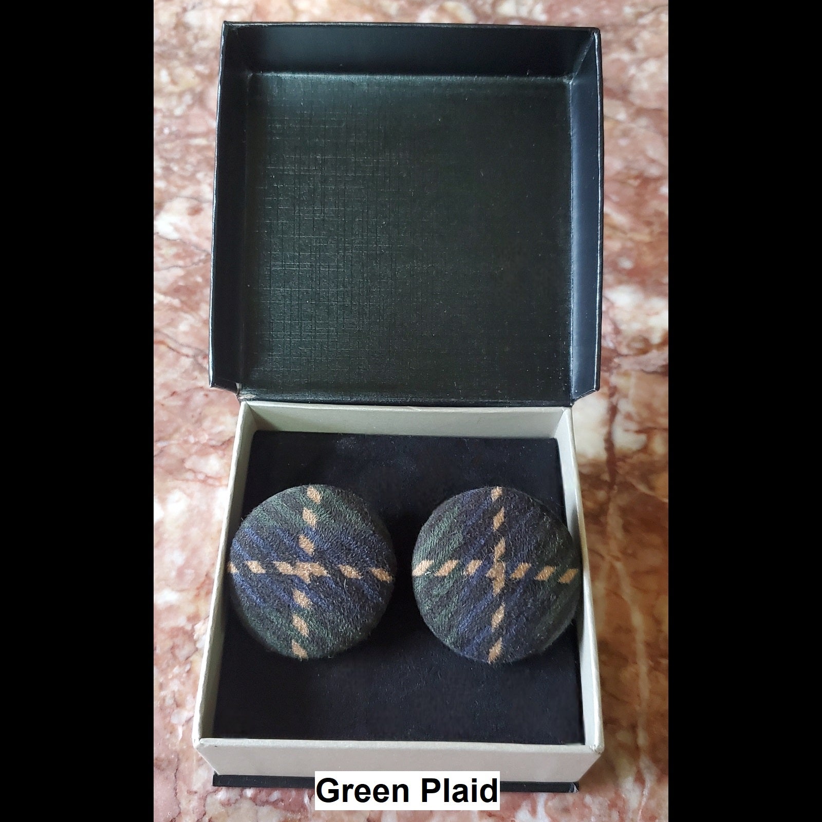 Green plaid button earrings in jewelry box 