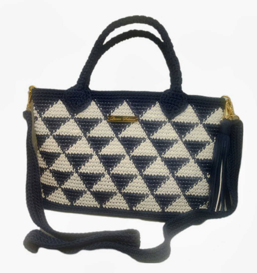Front view of Blue and white crochet geo print handbag with large tassel
