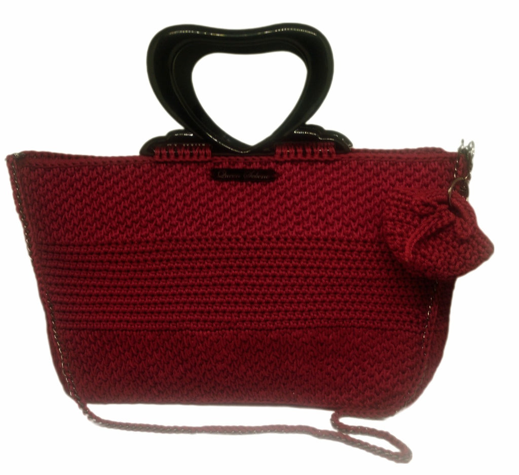 Front view of Burgundy crochet handbag with black heart shaped acrylic handle and mini handbag keychain
