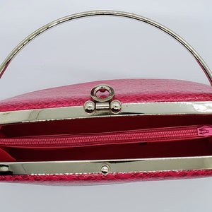 top inside view of hot pink snakeskin print handbag