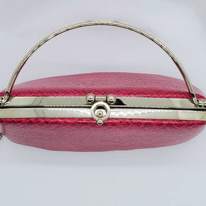 close up top view of hot pink snakeskin print handbag