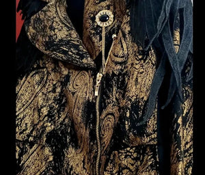 Close up front view of Moto jacket of 2 piece black and gold paisley suit with lace wing epaulettes