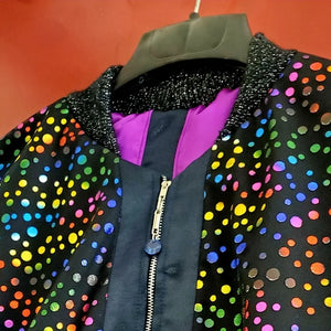 Close up collar view of Multi-coloured polka dot and denim bomber jacket