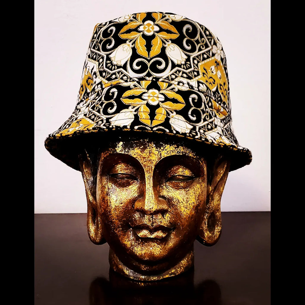Front view of Reversible black and yellow printed bucket hat