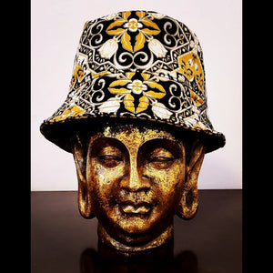 Front view of Reversible black and yellow printed bucket hat