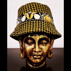 Reversed Front view of Reversible black and yellow printed bucket hat