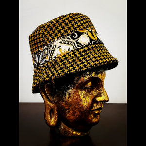 Reversed side view of Reversible black and yellow printed bucket hat 