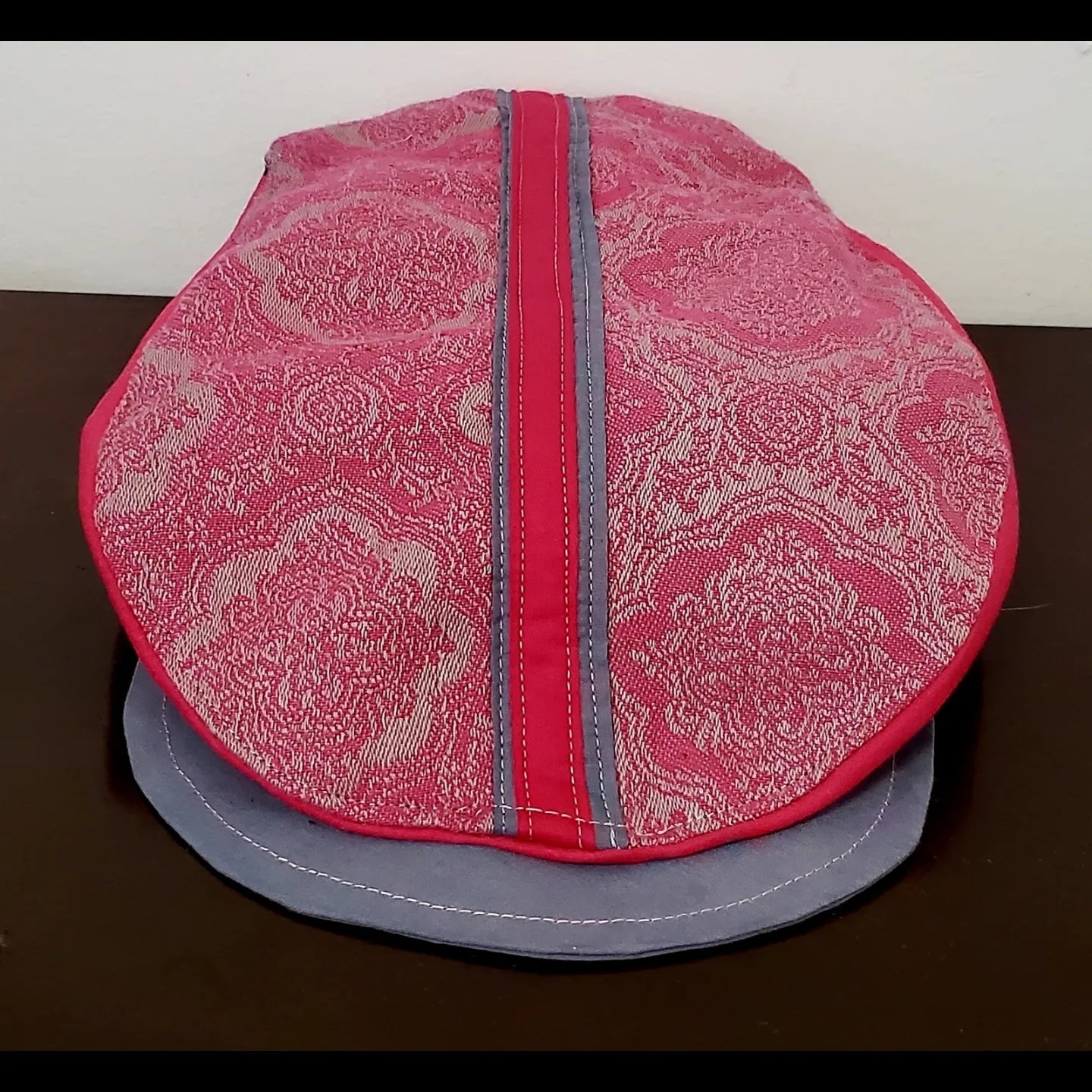 Front view of Pink and grey brocade print flat cap