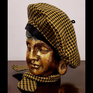 Side view. Yellow and black houndstooth beret and matching scarf on mannequin head