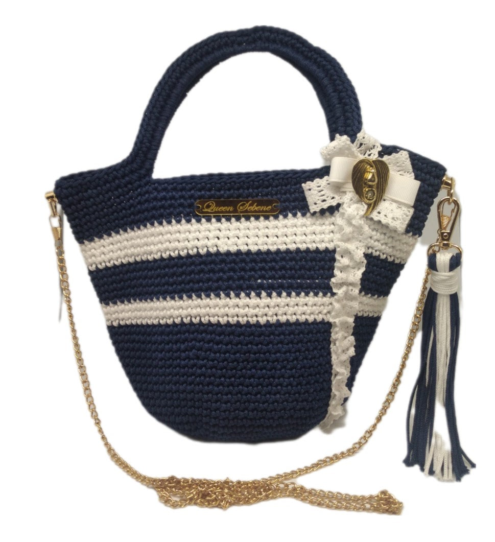 Front view of Navy and white striped crochet handbag with lace bow detail