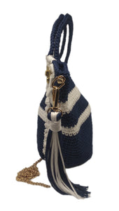 Side view of Navy and white striped crochet handbag with lace bow detail