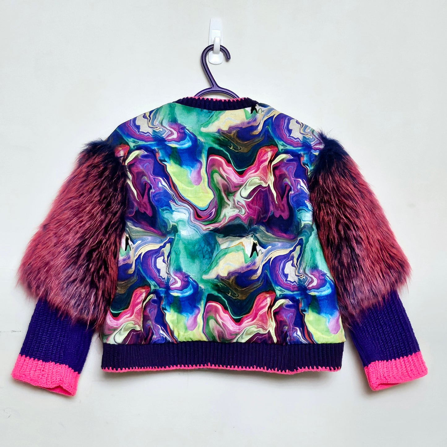 Back view of Rainbow bomber jacket with faux fur puffed sleeves