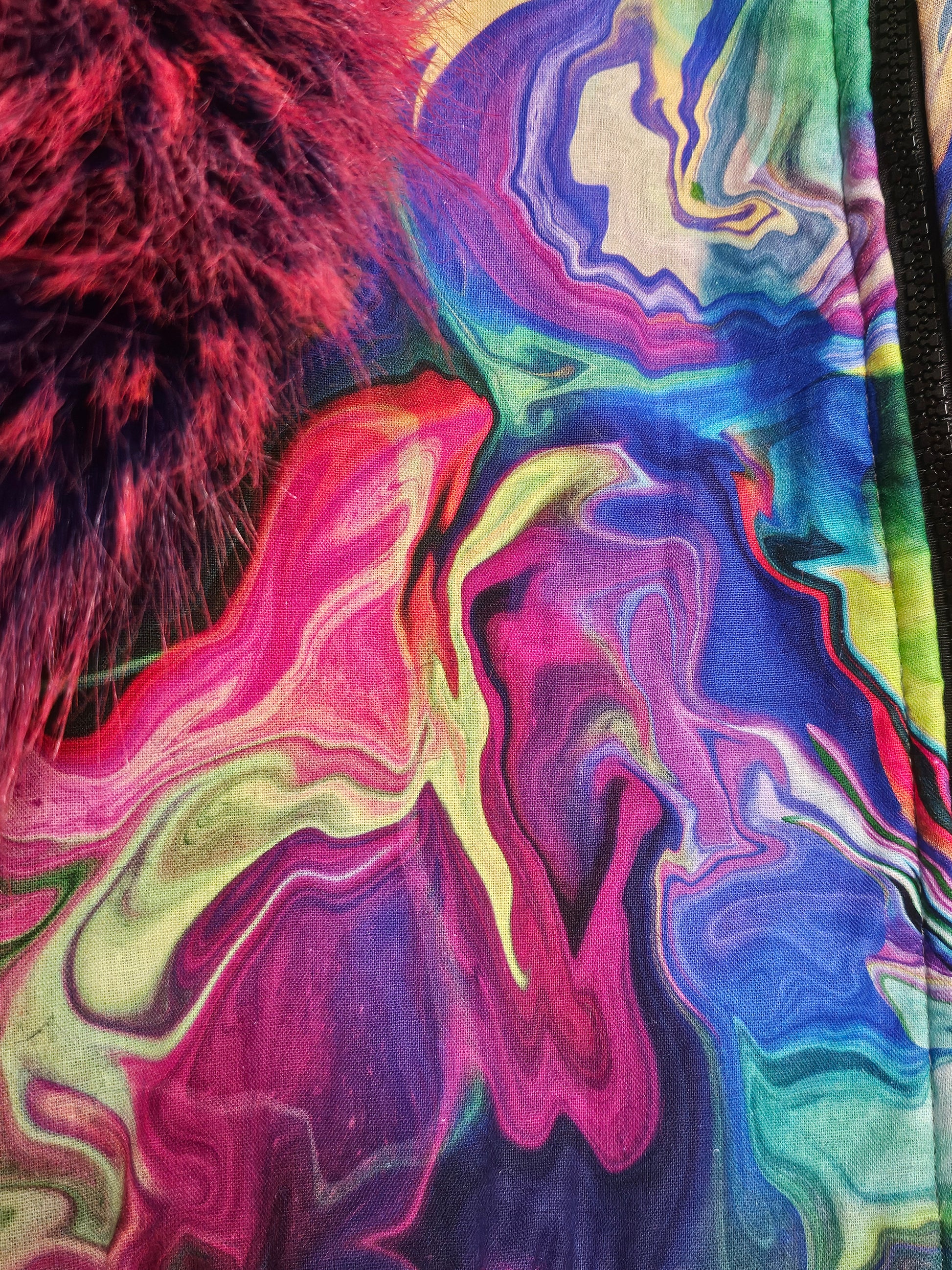 Fabric view of Rainbow bomber jacket with faux fur puffed sleeves