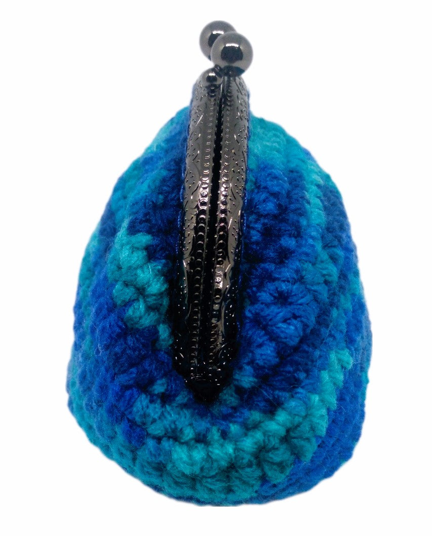 Side view. Variegated blue crochet coin purse with pewter kiss clasp frame. 